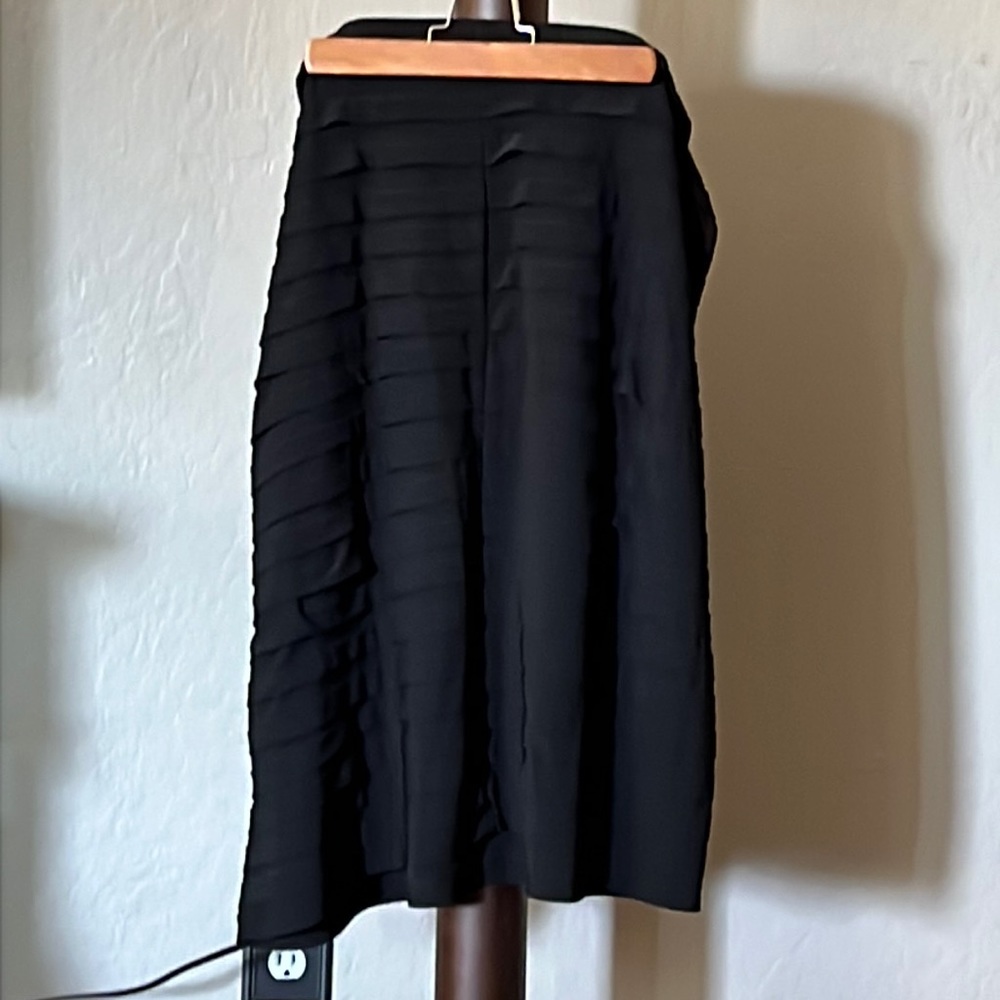 Used but in great condition pencil pleated black skirt